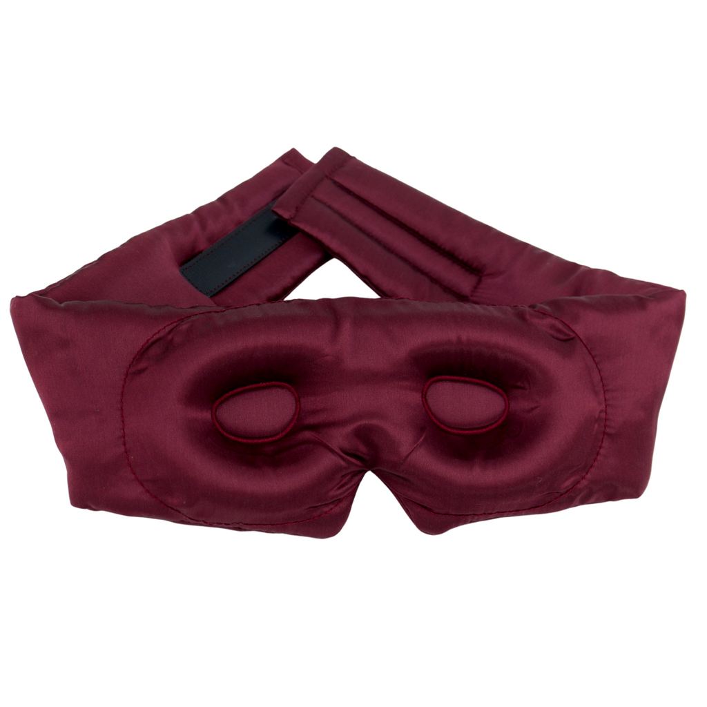A burgundy pure mulberry silk sleep mask with contour and an adjustable strap, displayed on a clean white background.