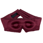 A burgundy pure mulberry silk sleep mask with contour and an adjustable strap, displayed on a clean white background.