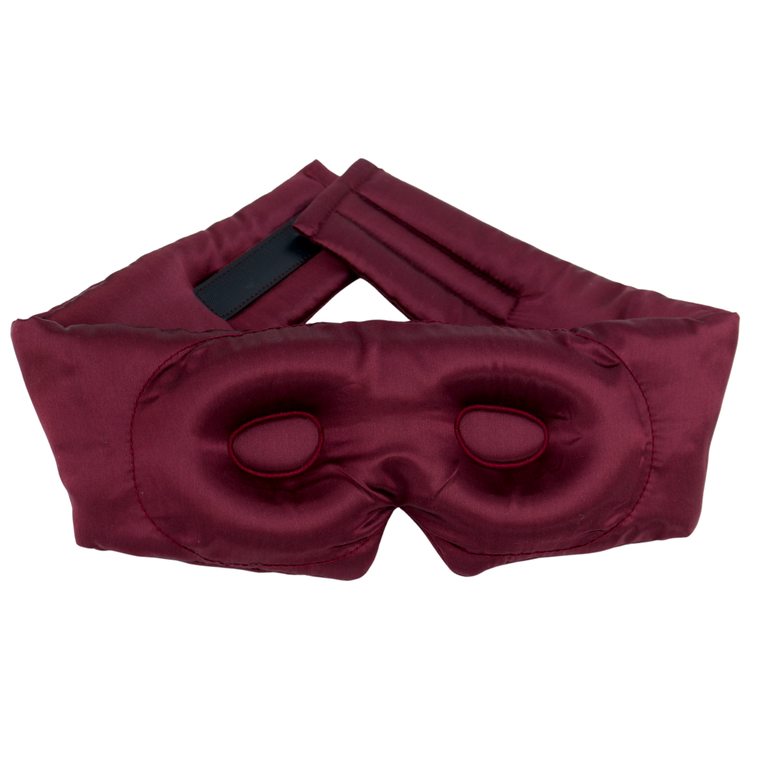 A burgundy pure mulberry silk sleep mask with contour and an adjustable strap, displayed on a clean white background.
